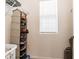 Neat walk-in closet, featuring a shelf, shoe rack, and natural light from the window at 3715 Capri Coast, Plant City, FL 33565