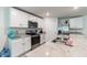 Well-equipped kitchen featuring an island, granite countertops, and stainless steel appliances at 3715 Capri Coast, Plant City, FL 33565