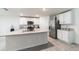 Bright kitchen features white cabinets, granite countertops, and stainless steel appliances at 3715 Capri Coast, Plant City, FL 33565