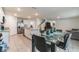 Bright kitchen and dining area featuring an island, stainless steel appliances, and an adjacent living space at 3715 Capri Coast, Plant City, FL 33565