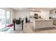 Modern kitchen with stainless appliances, a kitchen island, and adjacent dining space at 3715 Capri Coast, Plant City, FL 33565
