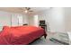 Spacious main bedroom with carpet flooring, and a ceiling fan, conveniently located near the en-suite bathroom at 3715 Capri Coast, Plant City, FL 33565