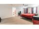 Spacious main bedroom with carpet flooring, a ceiling fan, and views of the en-suite bathroom at 3715 Capri Coast, Plant City, FL 33565