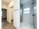 Contemporary bathroom features tiled shower with gray accents and modern fixtures at 80 Sequoyah Dr, Port Charlotte, FL 33954
