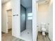 Modern bathroom with tiled shower, window, and toilet at 80 Sequoyah Dr, Port Charlotte, FL 33954