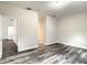 This spacious bedroom includes neutral walls, wood-look flooring, and ample natural light at 80 Sequoyah Dr, Port Charlotte, FL 33954