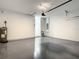 Spacious garage with epoxy flooring and plenty of room for parking and storage at 80 Sequoyah Dr, Port Charlotte, FL 33954