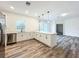 This kitchen includes quartz countertops, stainless steel appliances, and an island for casual dining at 80 Sequoyah Dr, Port Charlotte, FL 33954