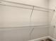 Walk-in closet offering ample storage space with wire shelving at 80 Sequoyah Dr, Port Charlotte, FL 33954