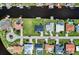 Stunning aerial view of waterfront homes featuring lush lawns and private docks along a tranquil canal at 5202 Forbes Ter, Port Charlotte, FL 33981