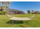 Enjoy relaxing in the backyard hammock with a great view of the beautiful waterfront property at 5202 Forbes Ter, Port Charlotte, FL 33981