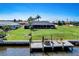 Lush backyard with a patio and boat dock on the canal at 5202 Forbes Ter, Port Charlotte, FL 33981