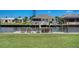Backyard waterfront view showing dock area, perfect for enjoying the water and outdoor recreation at 5202 Forbes Ter, Port Charlotte, FL 33981