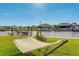 Hammock with waterfront views, situated on lush green grass, perfect for relaxing in this backyard paradise at 5202 Forbes Ter, Port Charlotte, FL 33981