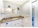 Beautifully renovated bathroom with granite counters and blue accents at 5202 Forbes Ter, Port Charlotte, FL 33981