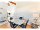 Bright dining area features modern table, chairs, wood floors, and a ceiling fan at 5202 Forbes Ter, Port Charlotte, FL 33981