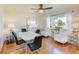 Bright dining room with wood floors, modern furniture, and plenty of natural light at 5202 Forbes Ter, Port Charlotte, FL 33981