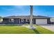 Beautiful single-story home with a well-manicured lawn and a two-car garage at 5202 Forbes Ter, Port Charlotte, FL 33981
