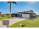 Charming single-story home with a spacious driveway and well-maintained landscaping at 5202 Forbes Ter, Port Charlotte, FL 33981