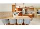 Well-equipped kitchen featuring wooden cabinets, granite countertops, stainless steel appliances, and ample counter space at 5202 Forbes Ter, Port Charlotte, FL 33981