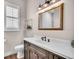 Bathroom with a vanity, toilet, modern fixtures, and plenty of natural light at 6306 Foxbrook Trl, Parrish, FL 34219