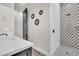 Modern bathroom featuring a sleek vanity, shower with decorative tile, and contemporary fixtures for a spa-like experience at 6306 Foxbrook Trl, Parrish, FL 34219