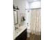 Well-lit bathroom features a vanity, toilet, bathtub with shower, and stylish curtain at 6306 Foxbrook Trl, Parrish, FL 34219
