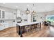 Spacious kitchen featuring a large center island with bar stool seating and an adjacent dining area at 6306 Foxbrook Trl, Parrish, FL 34219