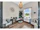Bright home office with a large window, neutral colors, hardwood floors, and stylish furnishings at 6306 Foxbrook Trl, Parrish, FL 34219