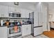 Well-equipped kitchen features modern stainless steel appliances, sleek countertops, ample cabinet storage, and tiled backsplash at 8614 Miramar Terrace Cir, Temple Terrace, FL 33637