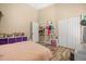 Bedroom featuring wood floors, cream color walls and a pink plush rug at 16805 Tobacco Rd, Lutz, FL 33558