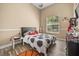 Bedroom with wood floors, a ceiling fan and natural light at 16805 Tobacco Rd, Lutz, FL 33558