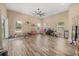 Spacious playroom with lots of natural light, wood floors and ceiling fan at 16805 Tobacco Rd, Lutz, FL 33558