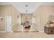 Formal dining room with decorative trim, elegant lighting, and stylish dining furniture at 16805 Tobacco Rd, Lutz, FL 33558