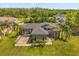 Stunning single-Gathering home with mature landscaping, basketball court, and welcoming entrance at 16805 Tobacco Rd, Lutz, FL 33558