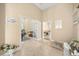 Foyer featuring neutral color walls, tile floors and multiple entries at 16805 Tobacco Rd, Lutz, FL 33558