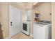 Laundry room featuring a washer, a dryer and neutral color walls at 16805 Tobacco Rd, Lutz, FL 33558