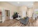 Spacious living room area with wood flooring and neutral walls at 16805 Tobacco Rd, Lutz, FL 33558