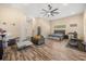 Large main bedroom suite with wood floors, a sitting area, and an attached en-suite bathroom at 16805 Tobacco Rd, Lutz, FL 33558