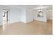 Open living room features tile flooring and sliding glass doors at 2486 Caring Way # 17A, Port Charlotte, FL 33952