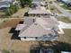 Home back view, featuring a new roof and proximity to other residential properties at 3105 Lockwood St, Port Charlotte, FL 33952