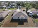 Back aerial view of this home with its new roof, rear patio, and tidy landscaping at 3105 Lockwood St, Port Charlotte, FL 33952