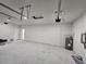Spacious garage with concrete floors, white brick walls, and ample room for storage at 3105 Lockwood St, Port Charlotte, FL 33952