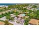 Beautiful aerial view of community center, pool, and surrounding lush landscaping with pond at 4062 Overture Cir # 4062, Bradenton, FL 34209