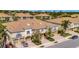 Aerial view of townhome complex with brick paved driveways, garages, and lush landscaping at 4062 Overture Cir # 4062, Bradenton, FL 34209