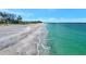 Gorgeous beach view with clean sand and turquoise waters, ideal for relaxing and enjoying the beautiful scenery at 4062 Overture Cir # 4062, Bradenton, FL 34209