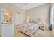 Bright bedroom with a ceiling fan, double door closet, and neutral carpet creates a cozy and welcoming atmosphere at 4062 Overture Cir # 4062, Bradenton, FL 34209