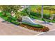 An attractive community entrance featuring lush landscaping, elegant signage, and well maintained surroundings at 4062 Overture Cir # 4062, Bradenton, FL 34209