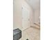 A bright entryway features tiled flooring, a sleek storage box, and leads to carpeted stairs to the upper level at 4062 Overture Cir # 4062, Bradenton, FL 34209