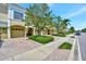 Inviting townhomes featuring attached garages, well-manicured landscaping, and brick paved driveways at 4062 Overture Cir # 4062, Bradenton, FL 34209